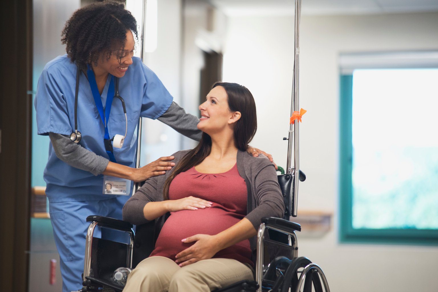 Pregnant woman on wheelchair in hospital